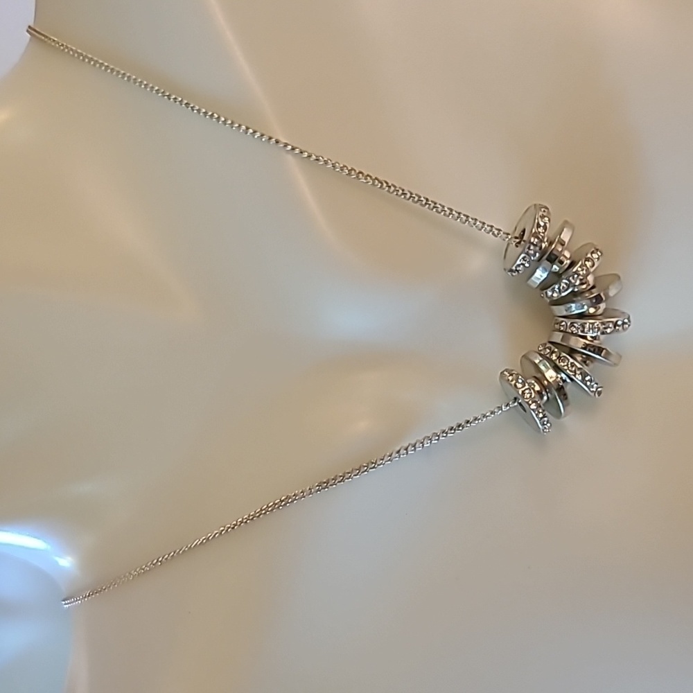 Kenneth Cole necklace with silver color and faux diamonds